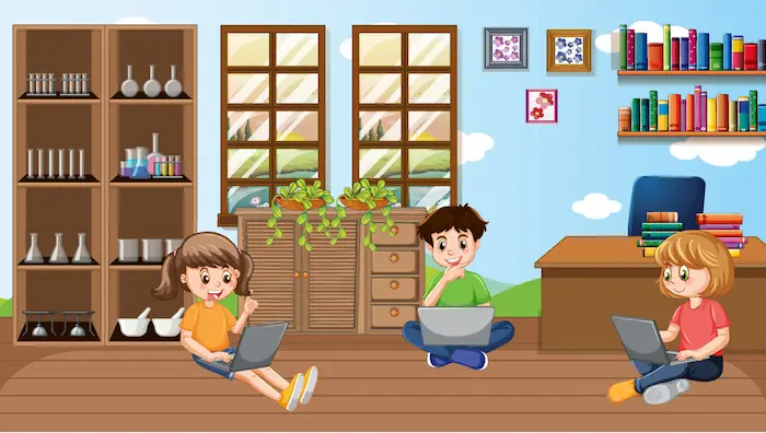 Niños usando laptops en un aula mientras aprenden actividades digitales.